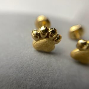 TOPO HUELLA PERRO ORO